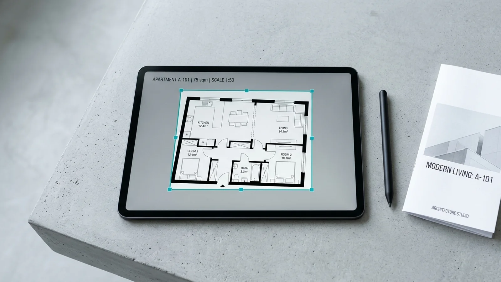 A smartphone held parallel above a flat paper floor plan